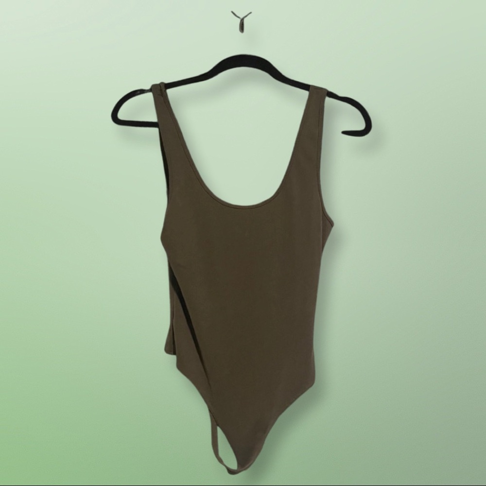 Olive green ribbed thong bodysuit. Never worn. Size M.